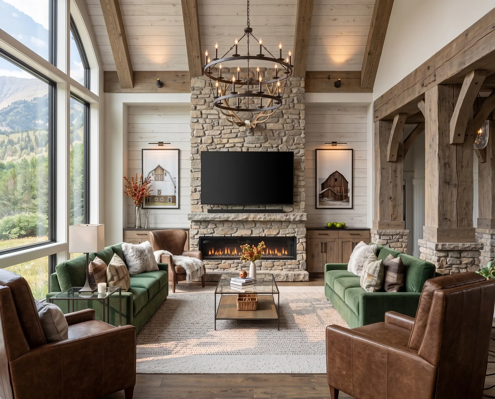 Great room with a stone fireplace, green sofas and mountain views
