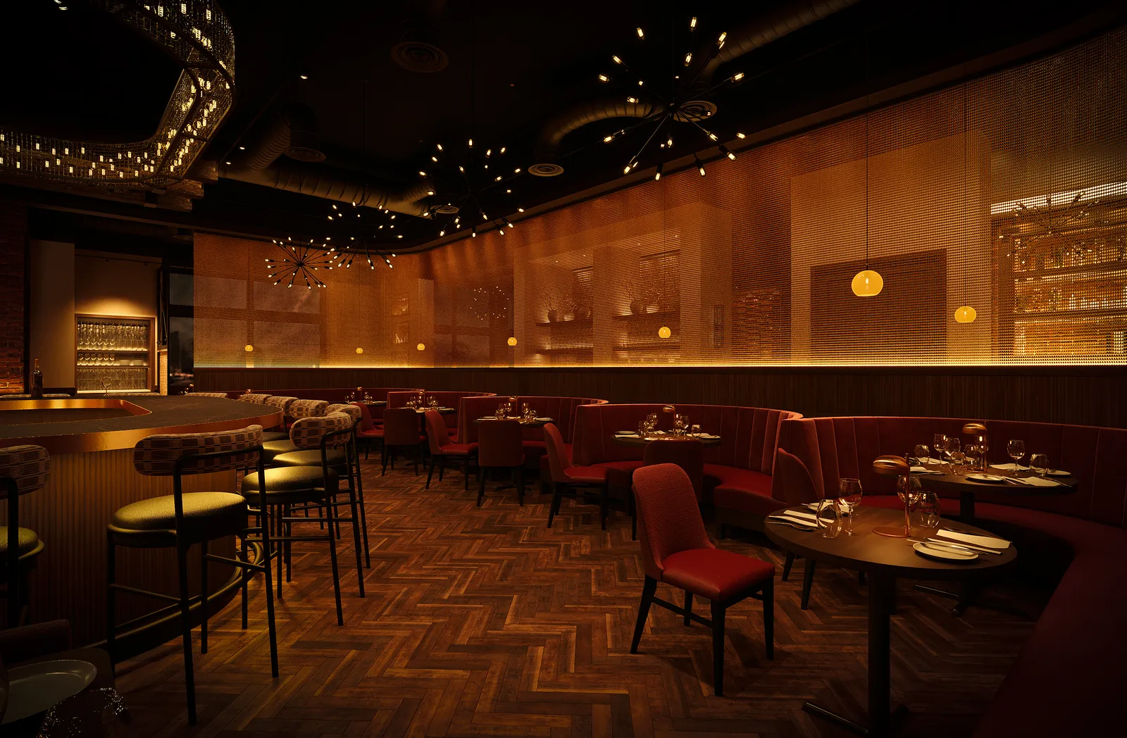 Dining room with red banquettes and a glowing wood-slat wall