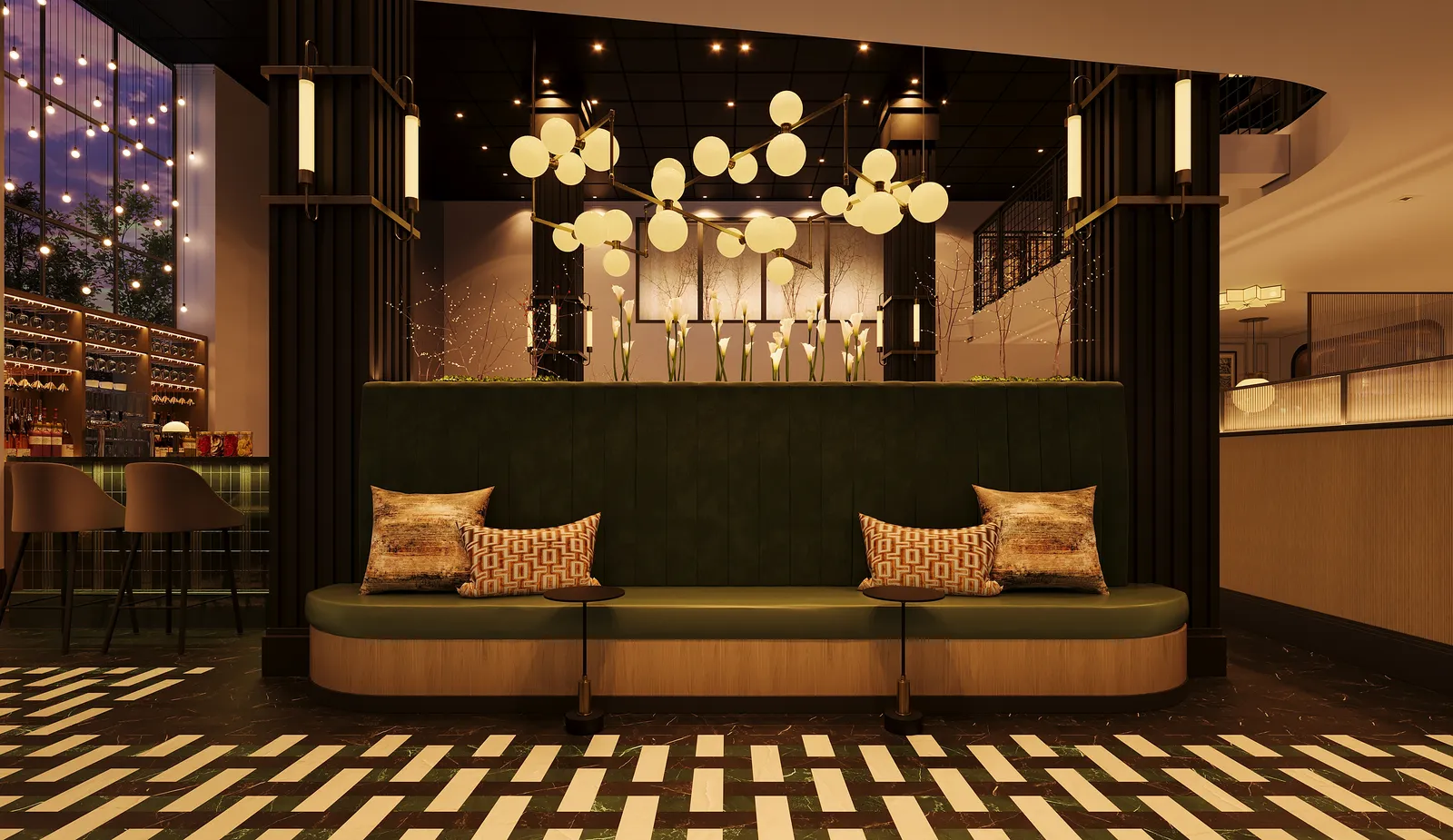 Lounge banquette under globe chandeliers beside the wine wall